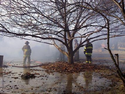 Company 1 operating on house fire